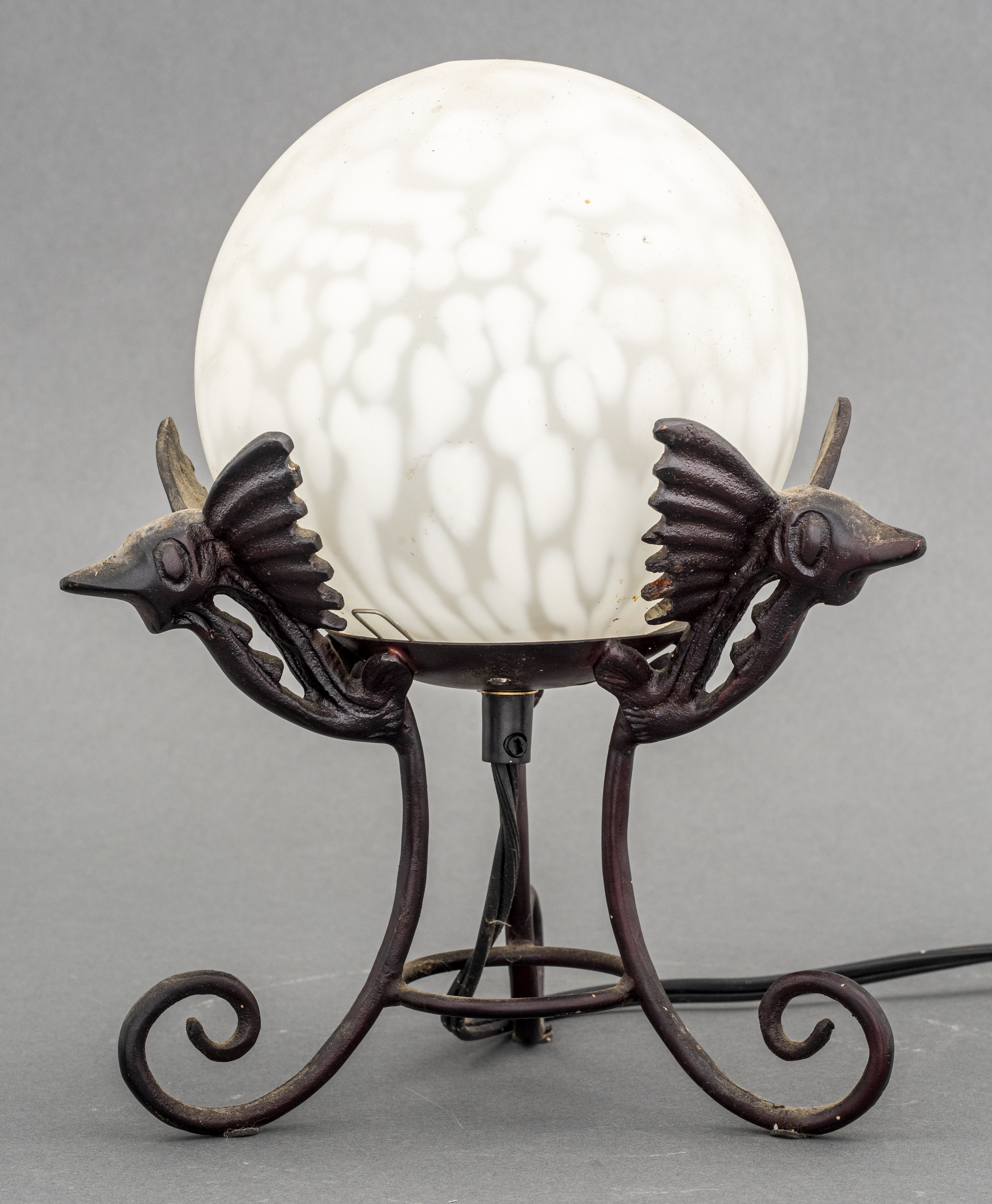 CAST IRON AND GLASS DRAGON TABLE
