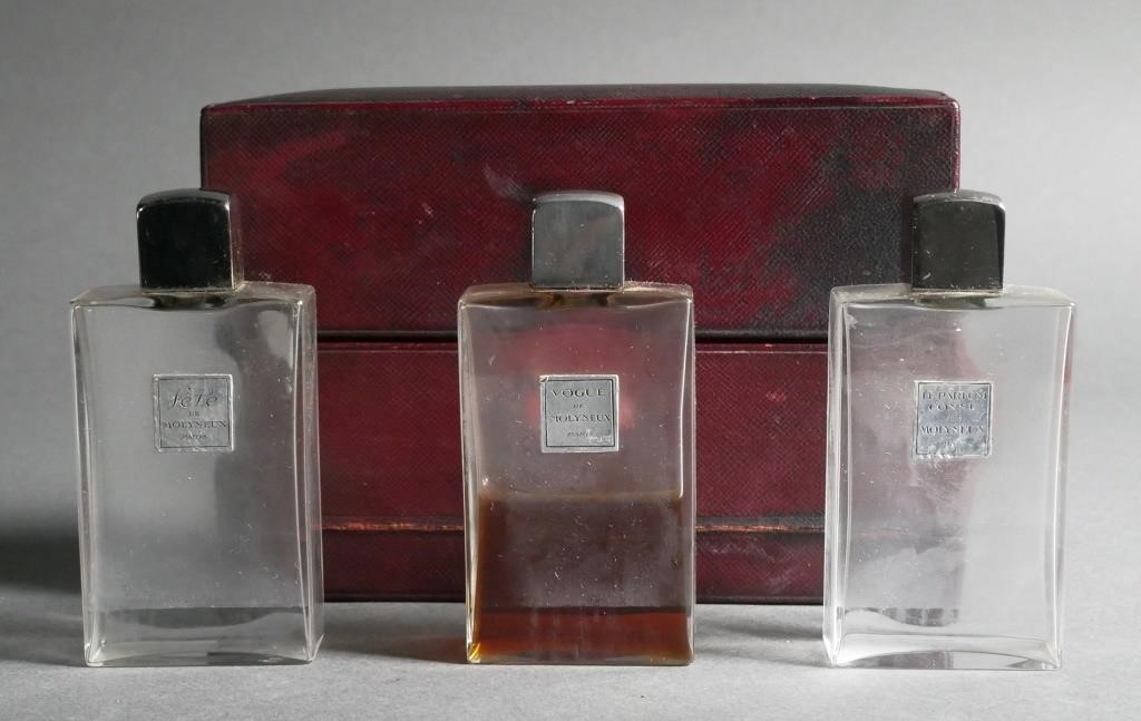 THREE MOLYNEUX PERFUME BOTTLES IN CASELeather