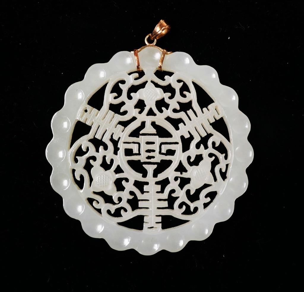 14K CARVED JADE ROUND PENDANTIntricately