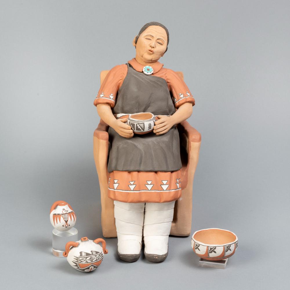 POTTERY WOMAN FIGURINE WITH POTTERY,