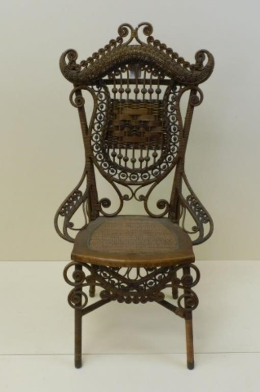 ELABORATE WICKER CHAIR, PROBABLY BY