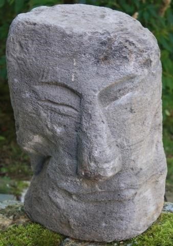 CARVED VOLCANIC ROCK FIGUREHEAD,