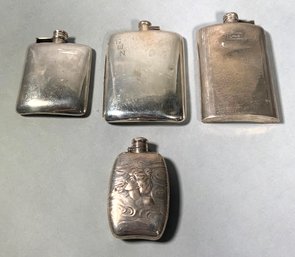 Four vintage sterling flasks, including;