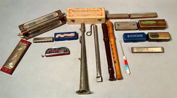 A collection of vintage harmonicas,