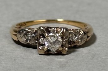 A 14k gold engagement ring, set