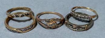 Five stamped 10k gold rings, with