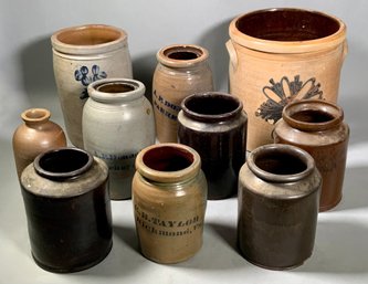 Ten stoneware and redware crocks, including