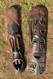 Two large carved wood African masks/wall