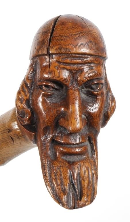 ANTIQUE CARVED HEAD WALKING STICKLikely