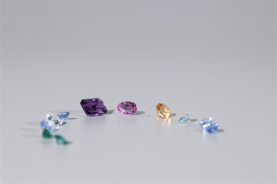 Group of eleven loose faceted gemstones;