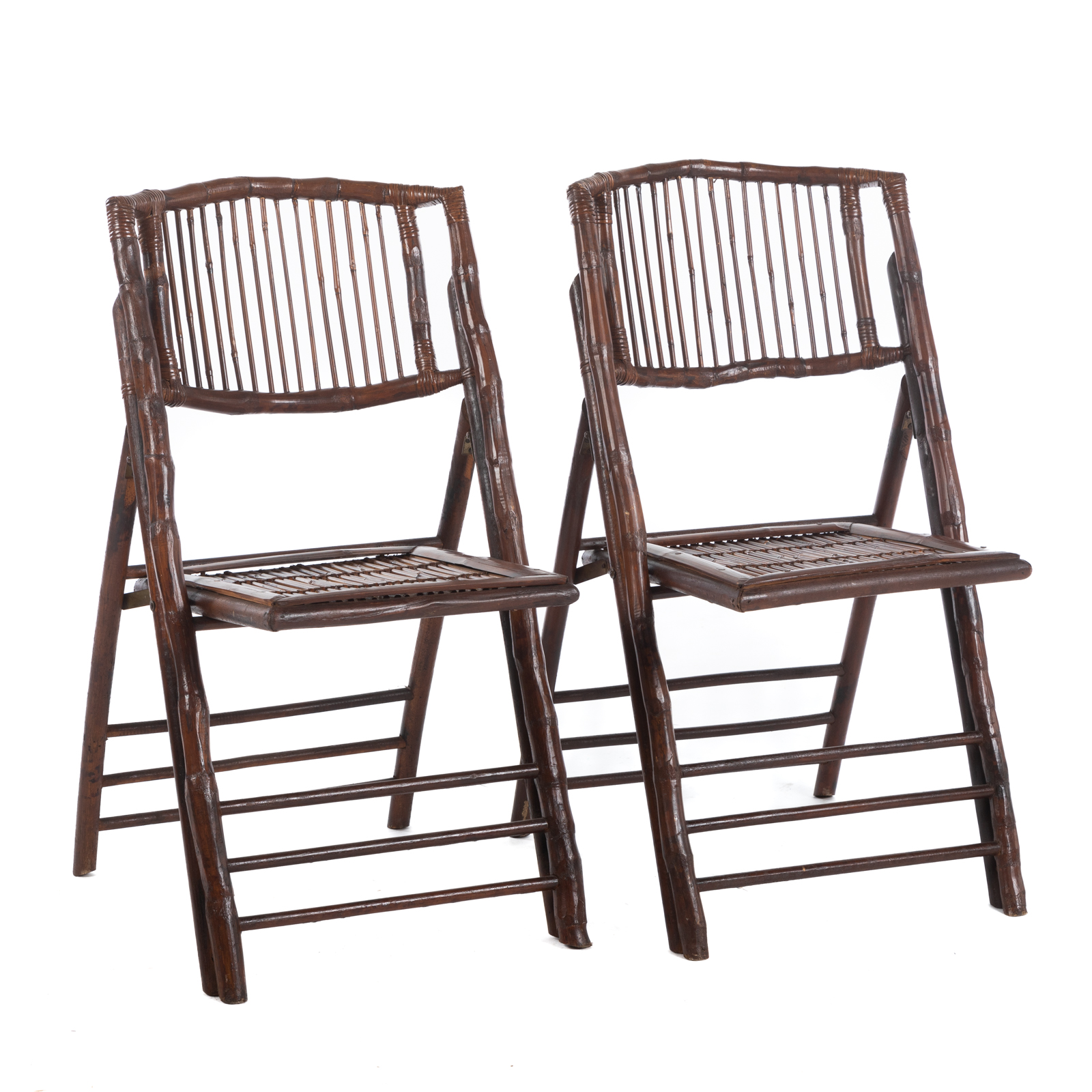 A PAIR OF FOLDING RATTAN CHAIRS