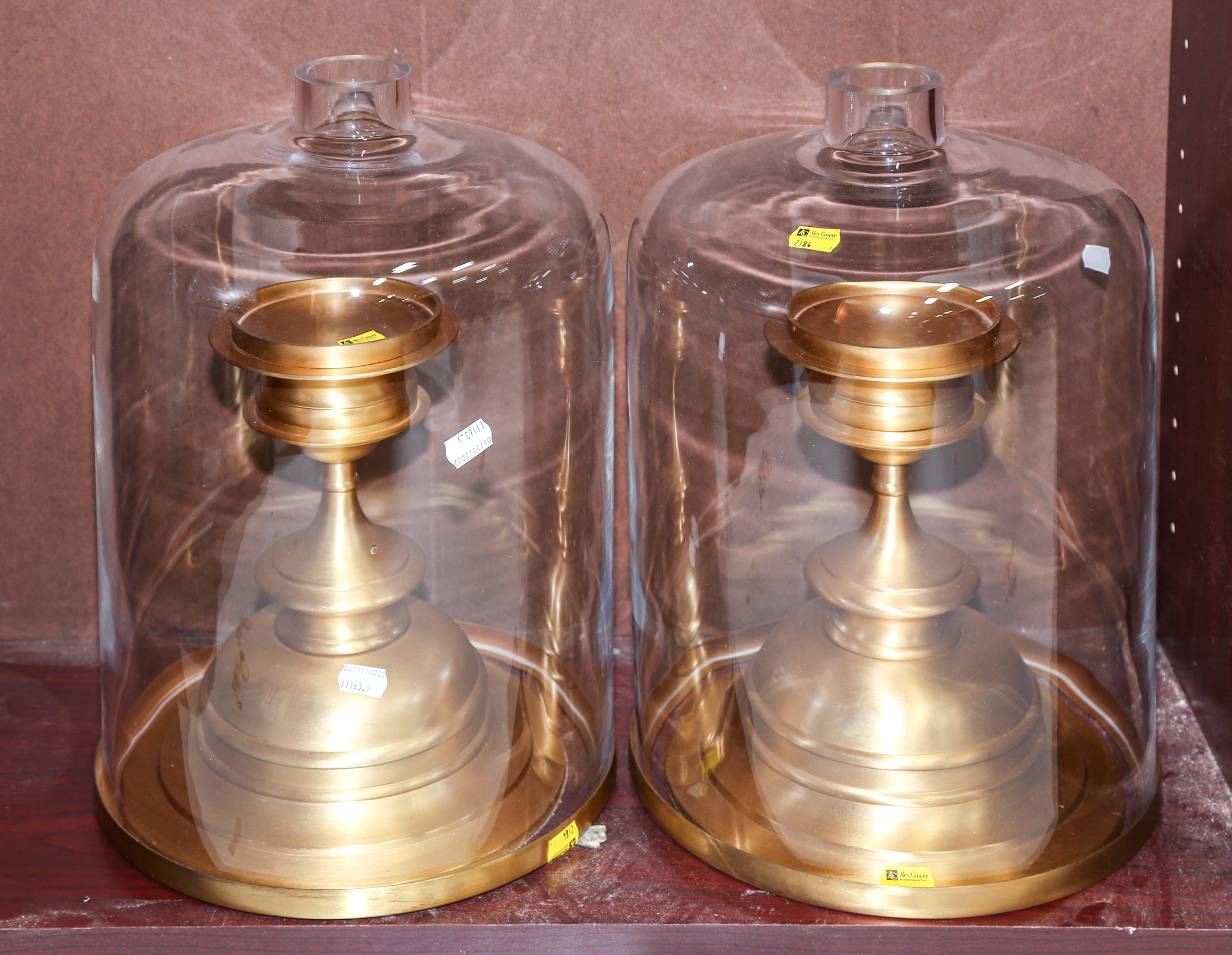 TWO BRASS CANDLE HOLDERS With glass