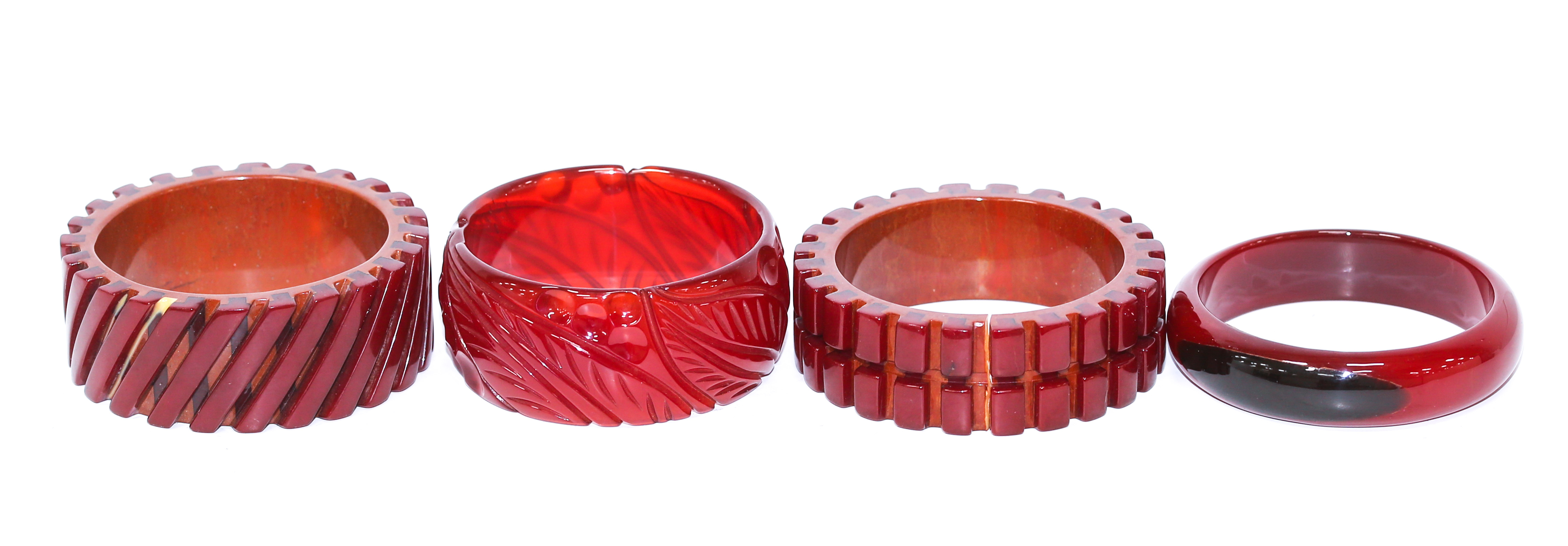 A COLLECTION OF RED BAKELITE BANGLES 369c34