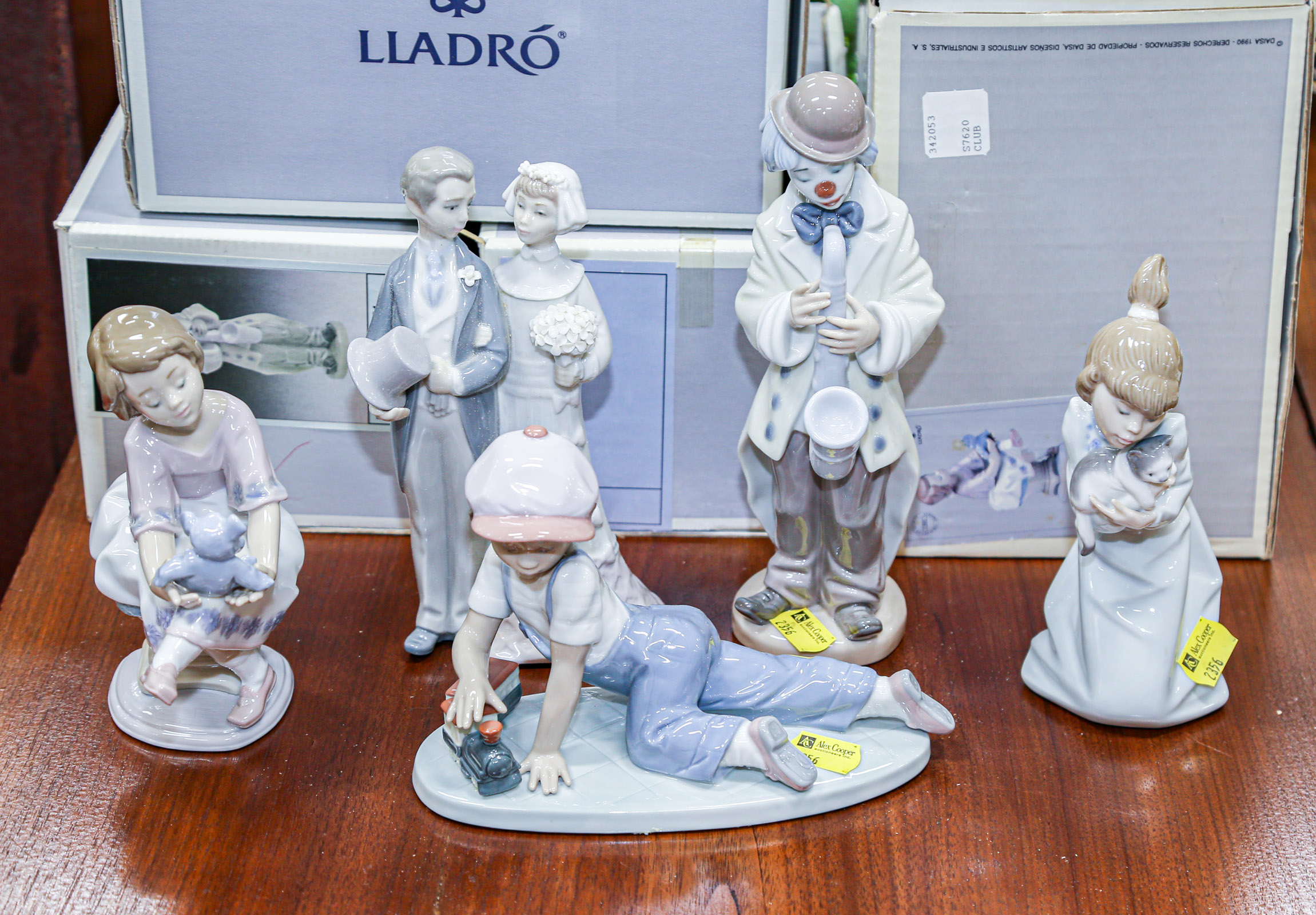 FIVE LLADRO FIGURES Four with boxes,