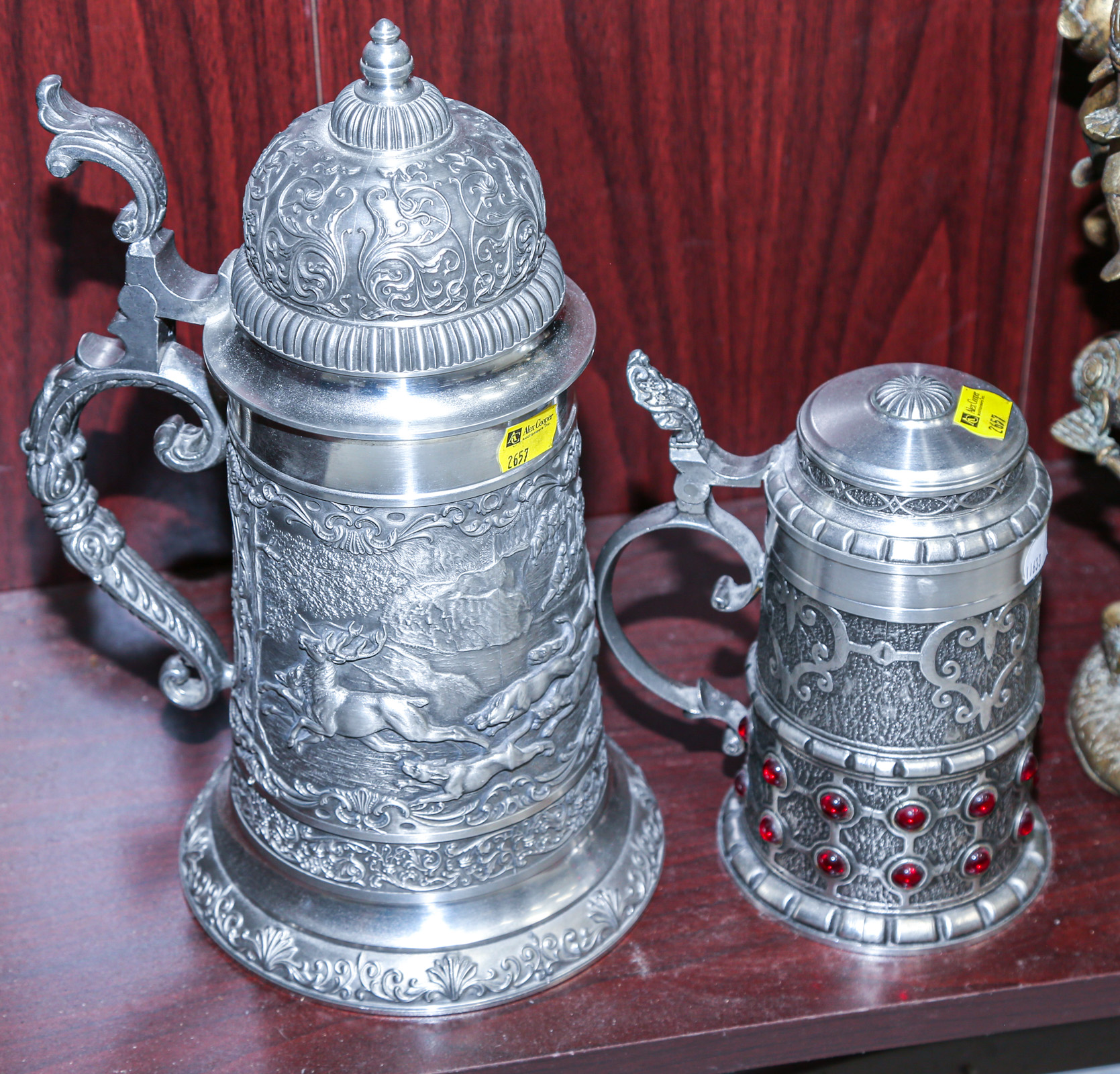TWO ORNATE PEWTER STEINS 7 1/2 to 11