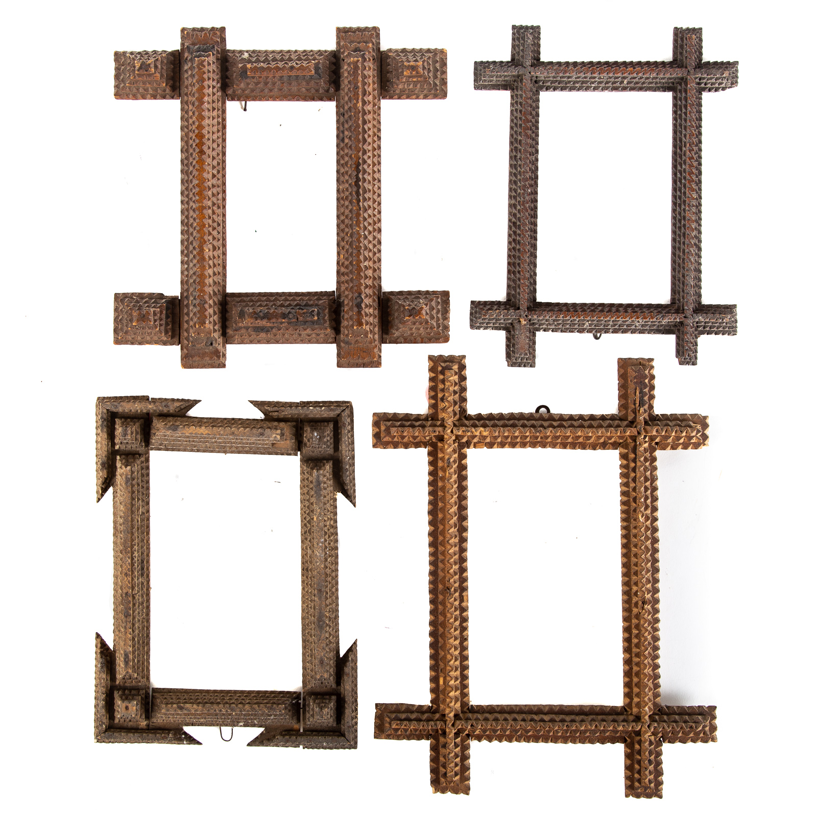 FOUR TRAMP ART NOTCH CARVED FRAMES