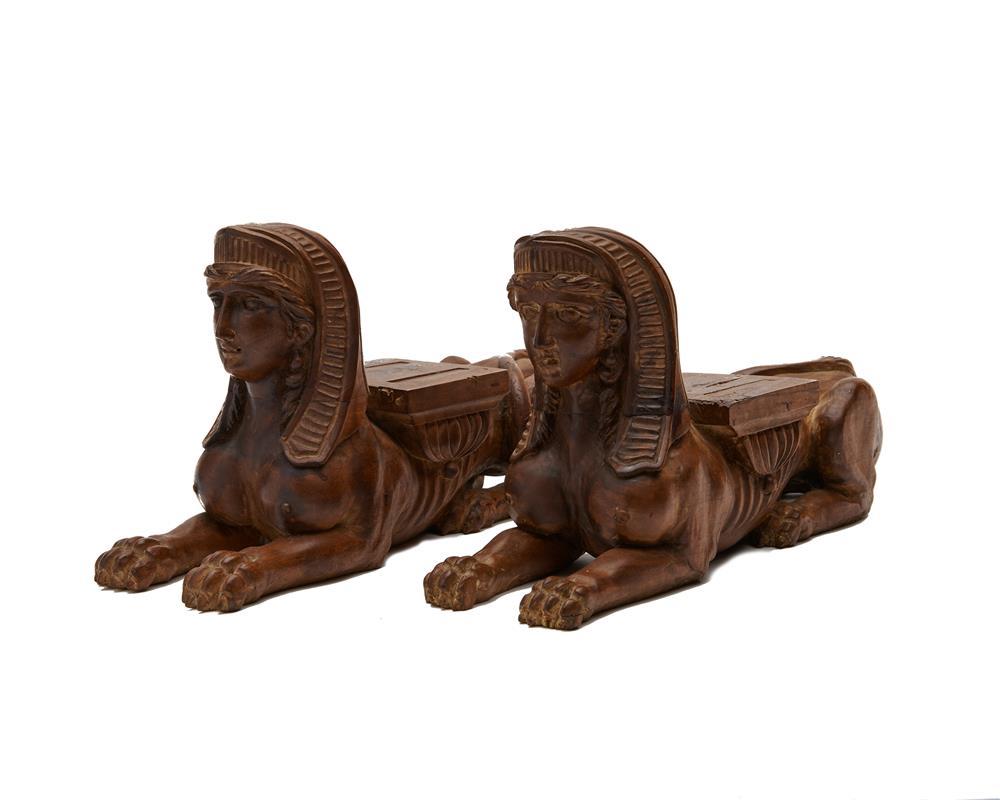 PAIR OF CARVED FRUITWOOD RECUMBENT