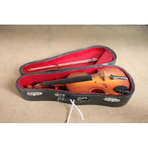 Small musical violin in case, approx