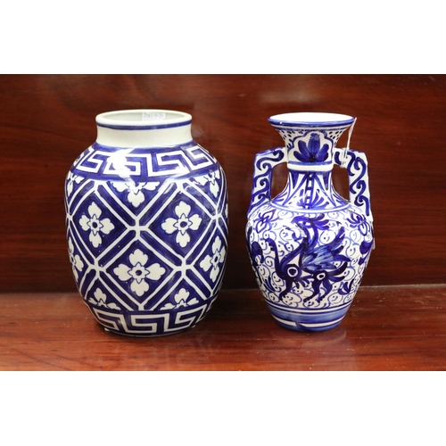 Two blue and white vases, each approx