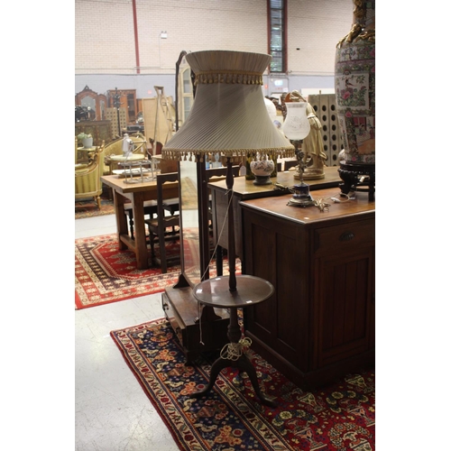 Standard lamp with circular table section,