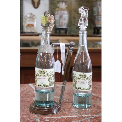 Two Moulin Rouge wine bottles,