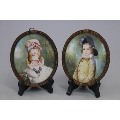 Pair of French portrait miniatures of