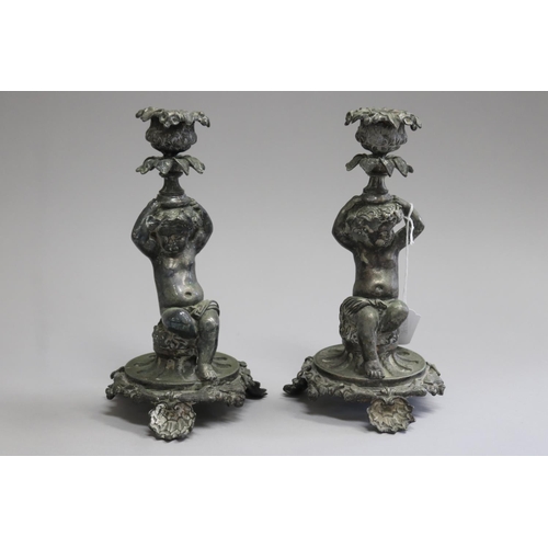 Pair of silvered bronzed candlesticks