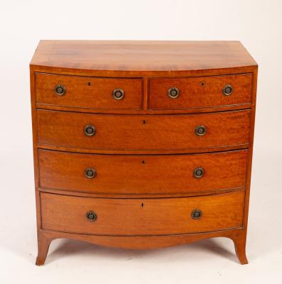 A mahogany bow fronted chest of two