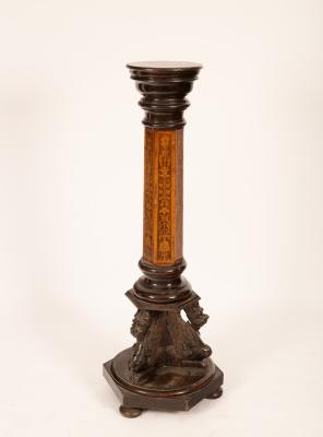 An Edwardian torchère with ebonised