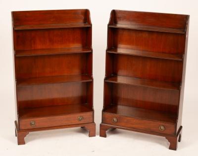 A pair of mahogany waterfall front open