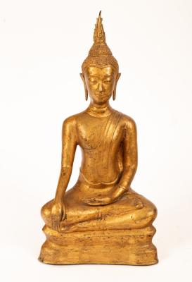 A Far Eastern gilt metal figure of a