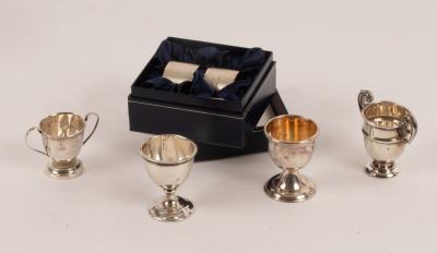 Three miniature silver trophy cups,