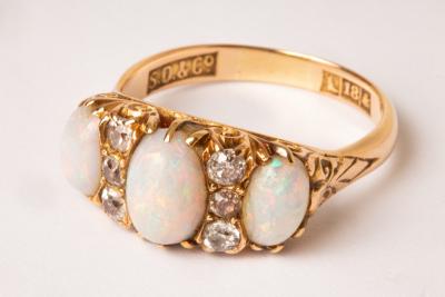 An 18ct gold diamond and opal set