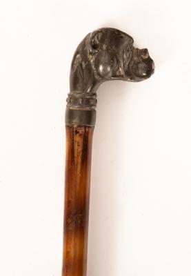 A cane walking stick, the spelter finial
