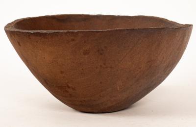 A large sandstone bowl with a label 36b3bc