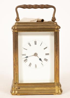 A gilt brass carriage clock, fitted