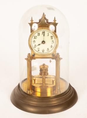 A gilt brass cased mantel clock
