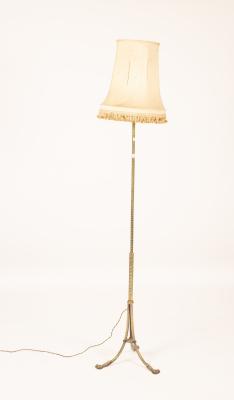 An engraved brass standard lamp