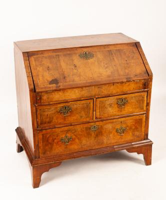 An 18th Century walnut bureau, the hinged