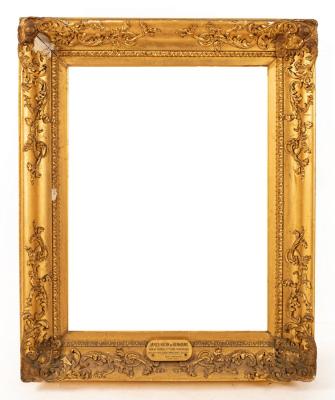 A gilt plaster picture frame applied