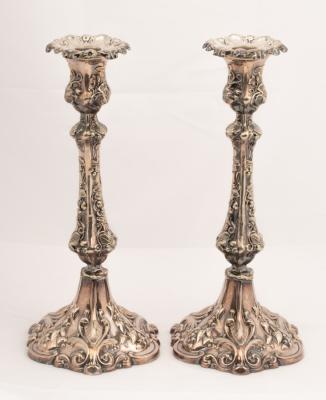 A pair of silver plated candlesticks  36b657
