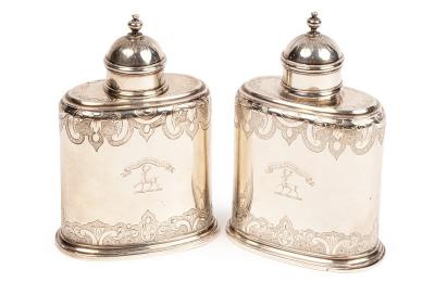 A pair of George I silver tea caddies,