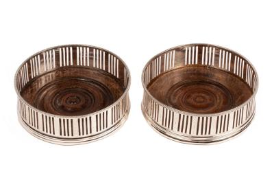 Two George III silver wine coasters,