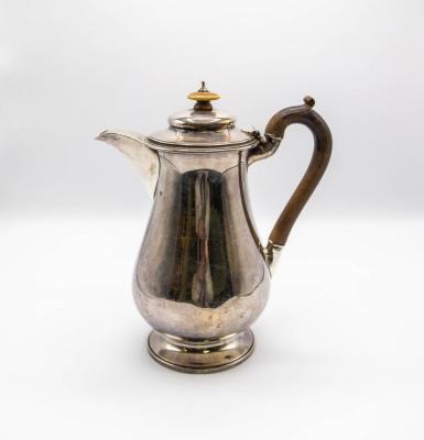 A George IV silver hot water jug,
