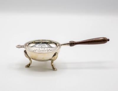 A silver tea strainer, William Comyns