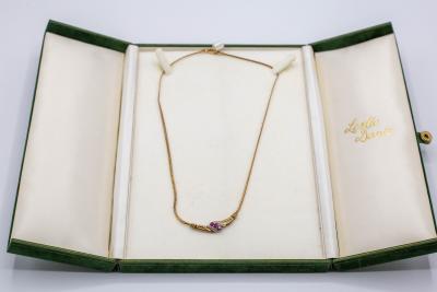 A diamond and ruby pendant necklace,
