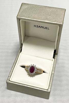 An 18t gold ruby and diamond ring,