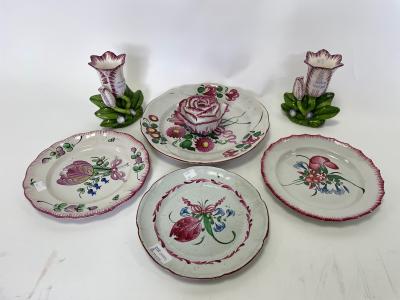 Four pink flower painted faience plates,