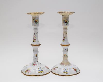 A pair of enamel candlesticks  36b932