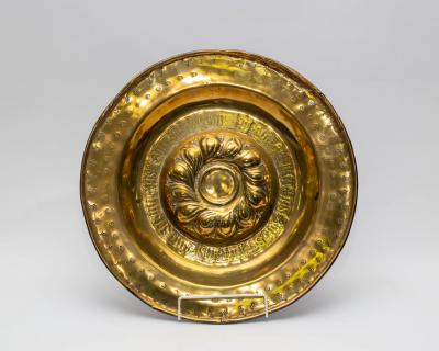 A Nuremberg brass alms dish, late
